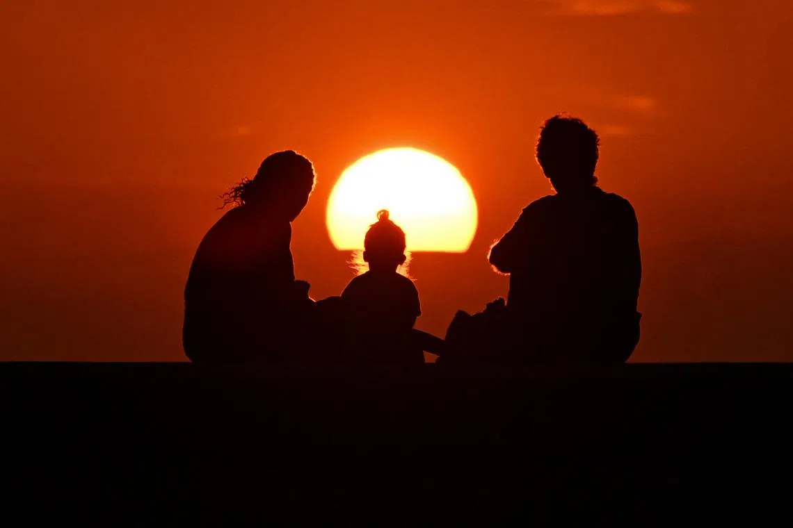 A family watching the sunset in Havana, on Feb 19, 2026. 