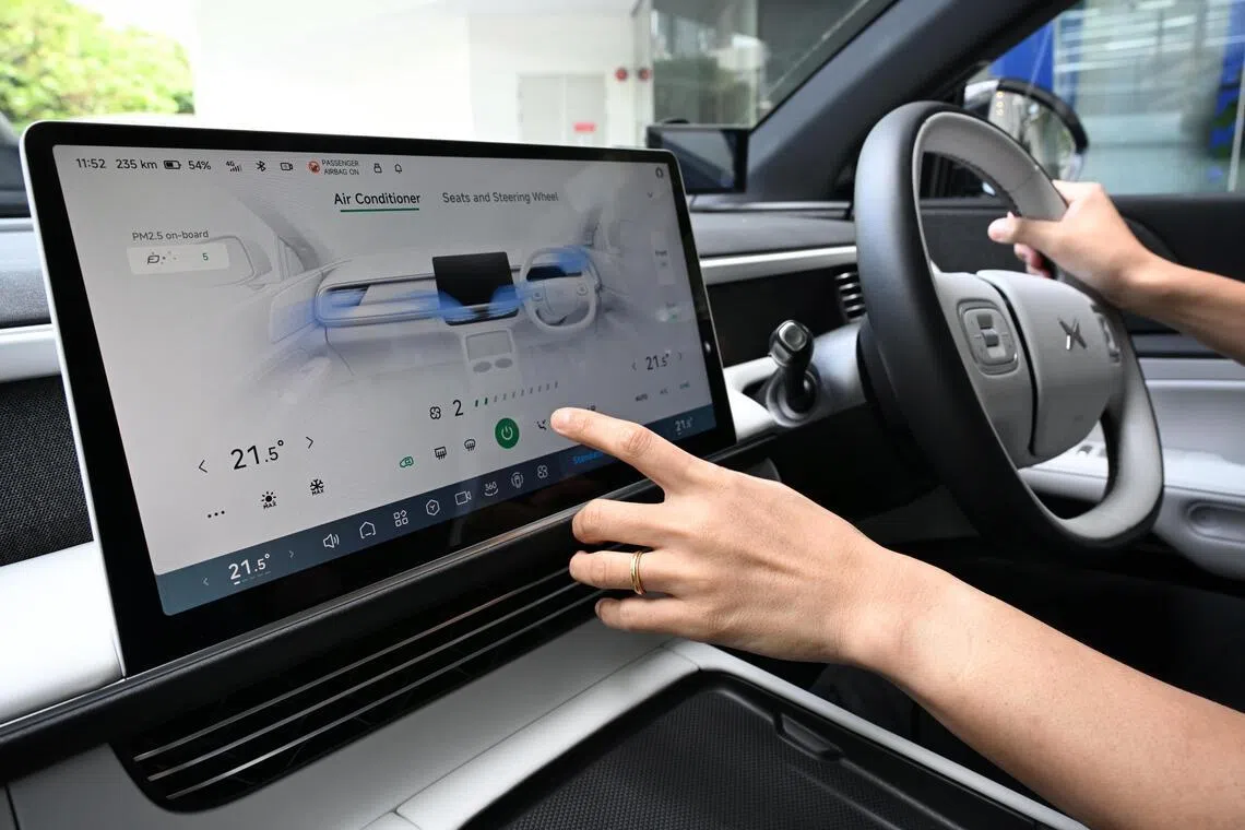 Generic photo of a driver adjusting the airconditioning in the electric car Xpeng G6 taken on Feb 10, 2025.