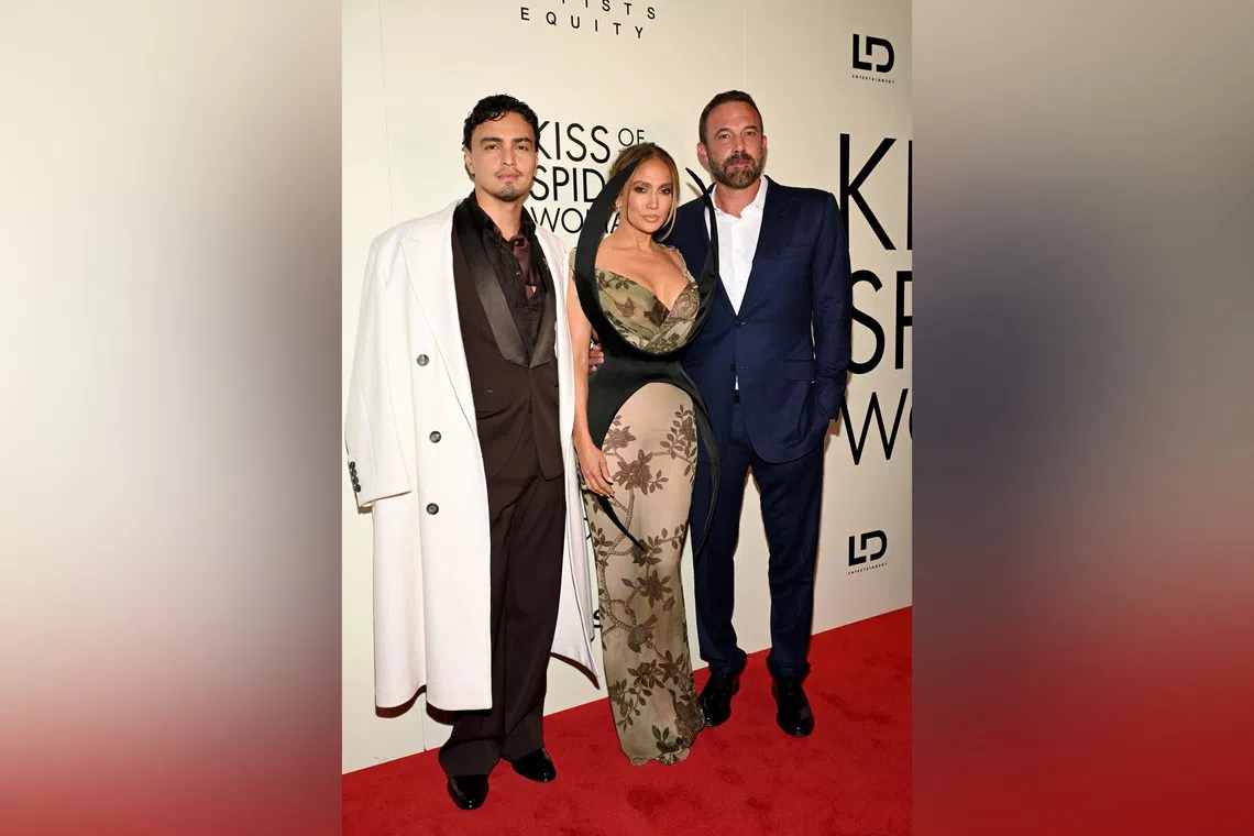 Jennifer Lopez (centre) and Ben Affleck (left), together with American actor Tonatiuh (far left),  at the premiere.