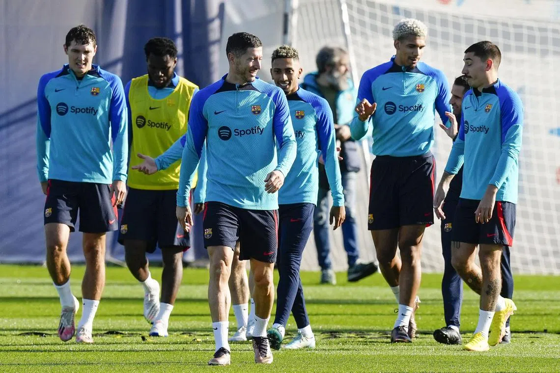 Barcelona's Robert Lewandowski (front) and teammates during a training session on Dec 23. The Polish striker is suspended for the Catalan derby against Espanyol on Saturday.