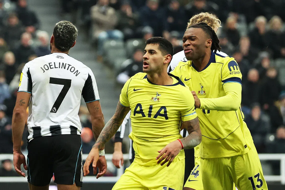 Soccer Football - Premier League - Newcastle United v Tottenham Hotspur - St James' Park, Newcastle, Britain - December 2, 2025 Tottenham Hotspur's Cristian Romero celebrates scoring their second goal with Destiny Udogie REUTERS/Scott Heppell