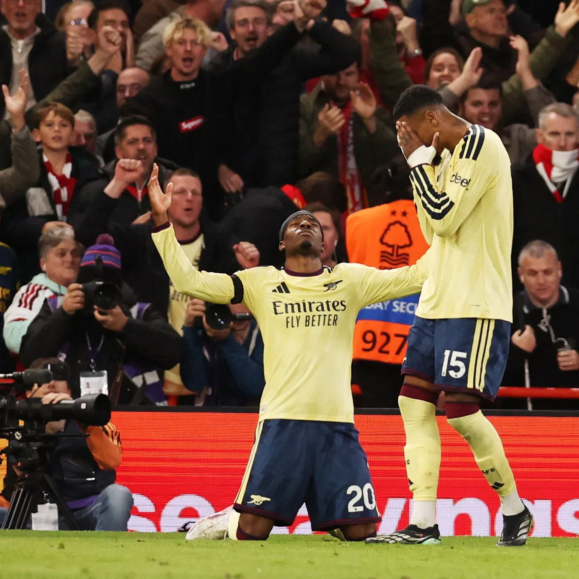 Arsenal’s Noni Madueke celebrates scoring their first goal against Nottingham Forest with Ezri Konsa on Oct 18.