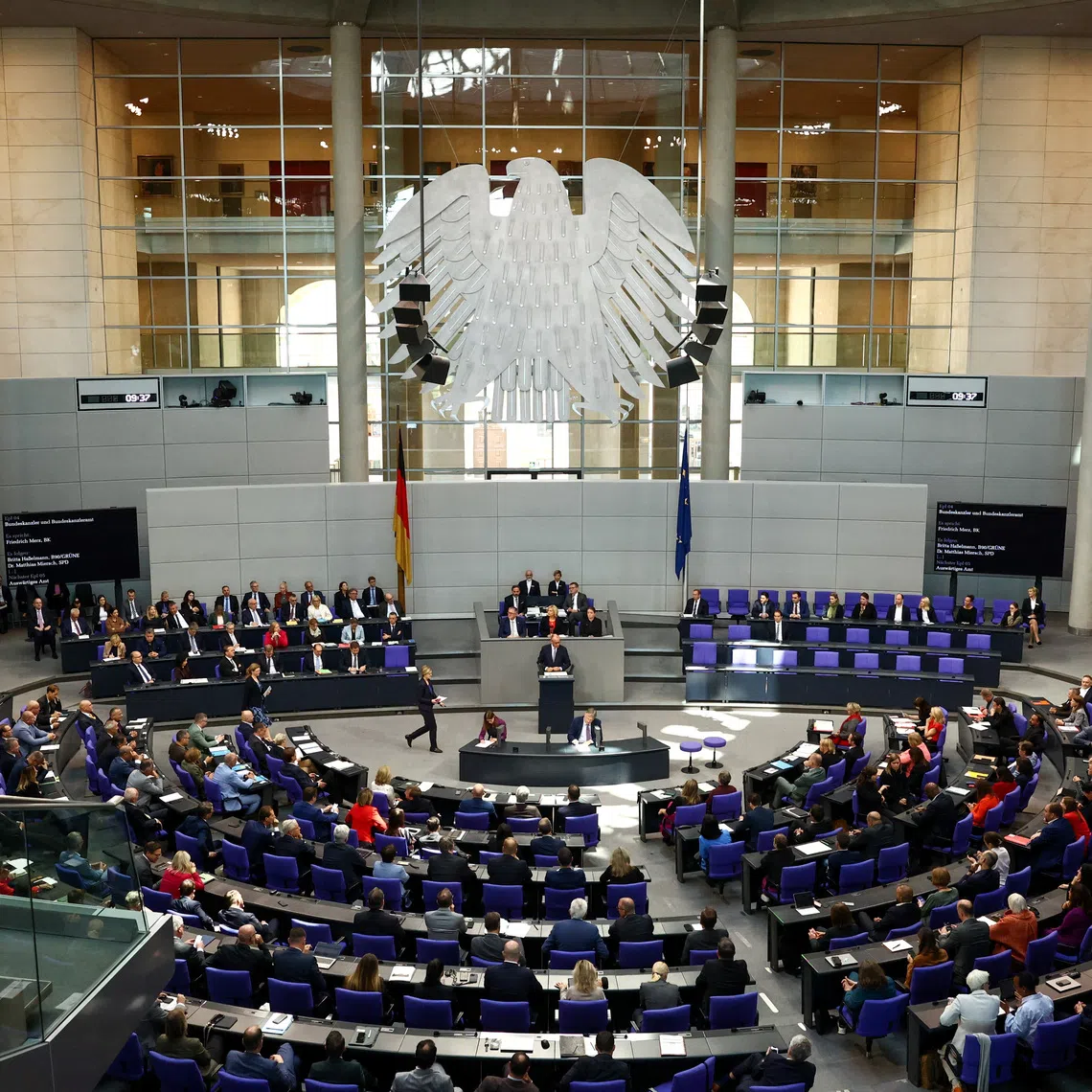 FILE PHOTO: German Chancellor Friedrich Merz speaks during a debate at the Bundestag, in Berlin, Germany, September 24, 2025. REUTERS/Liesa Johannssen/File Photo