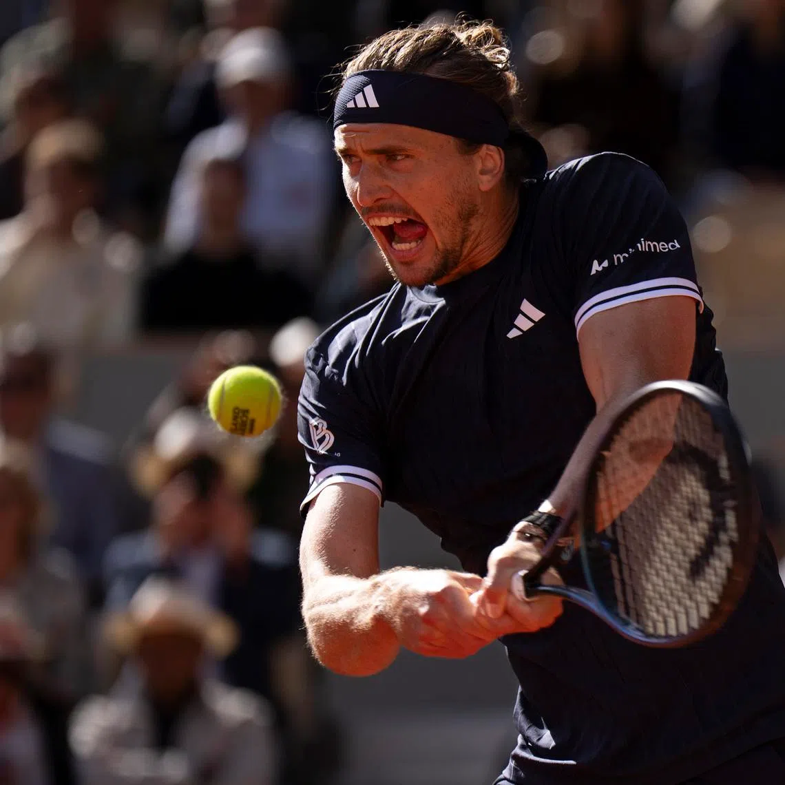 Alexander Zverev of Germany returns a shot during his match against Jakub Mensik of Czechia on day 12 at Stade Roland Garros, Paris, France, Jun 5, 2026. Mandatory Credit: Susan Mullane-Imagn Images