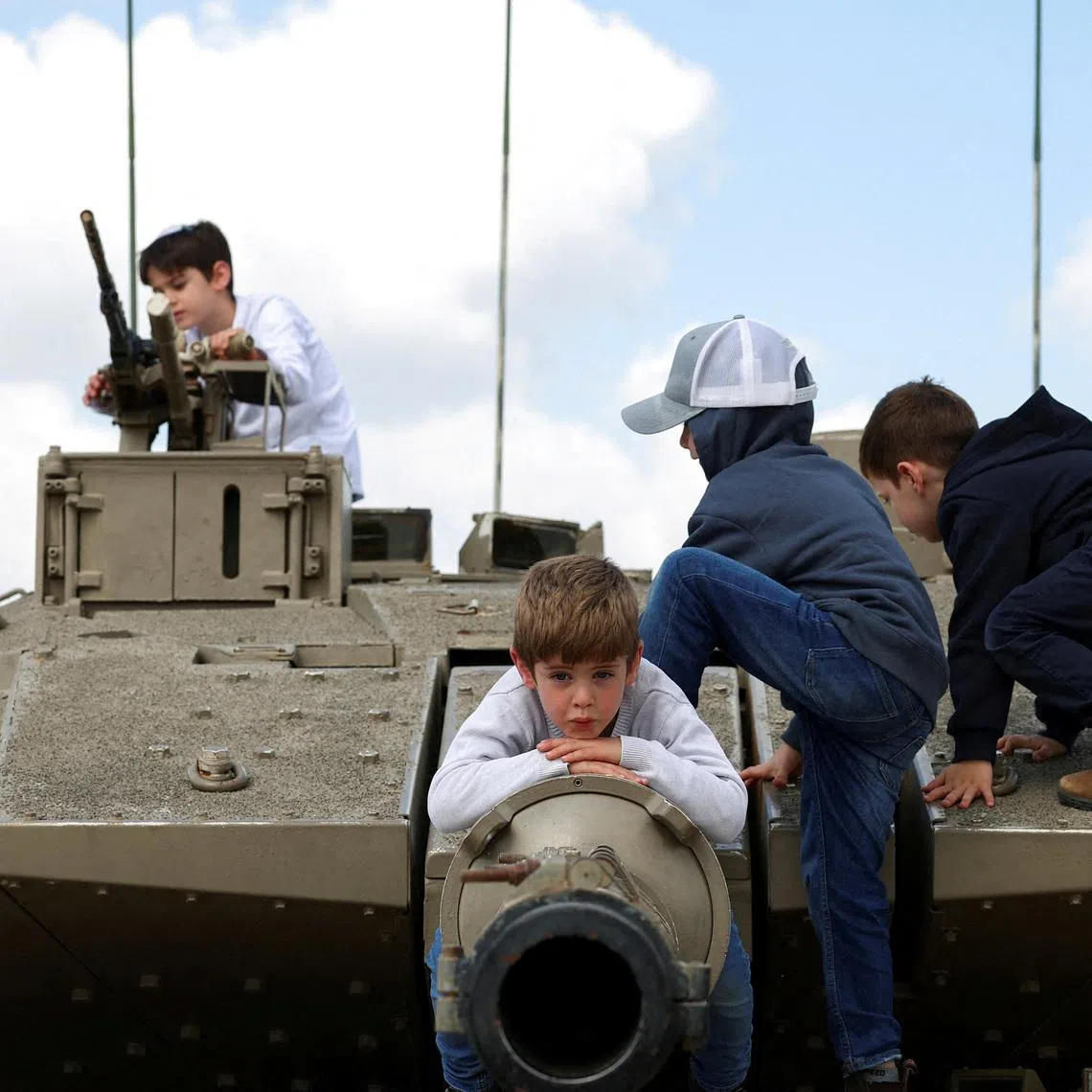 Children playing atop a tank, on Israel's Memorial Day, which commemorates fallen soldiers of Israel's wars and Israeli victims of hostile attacks, in Latrun, Israel, April 21.