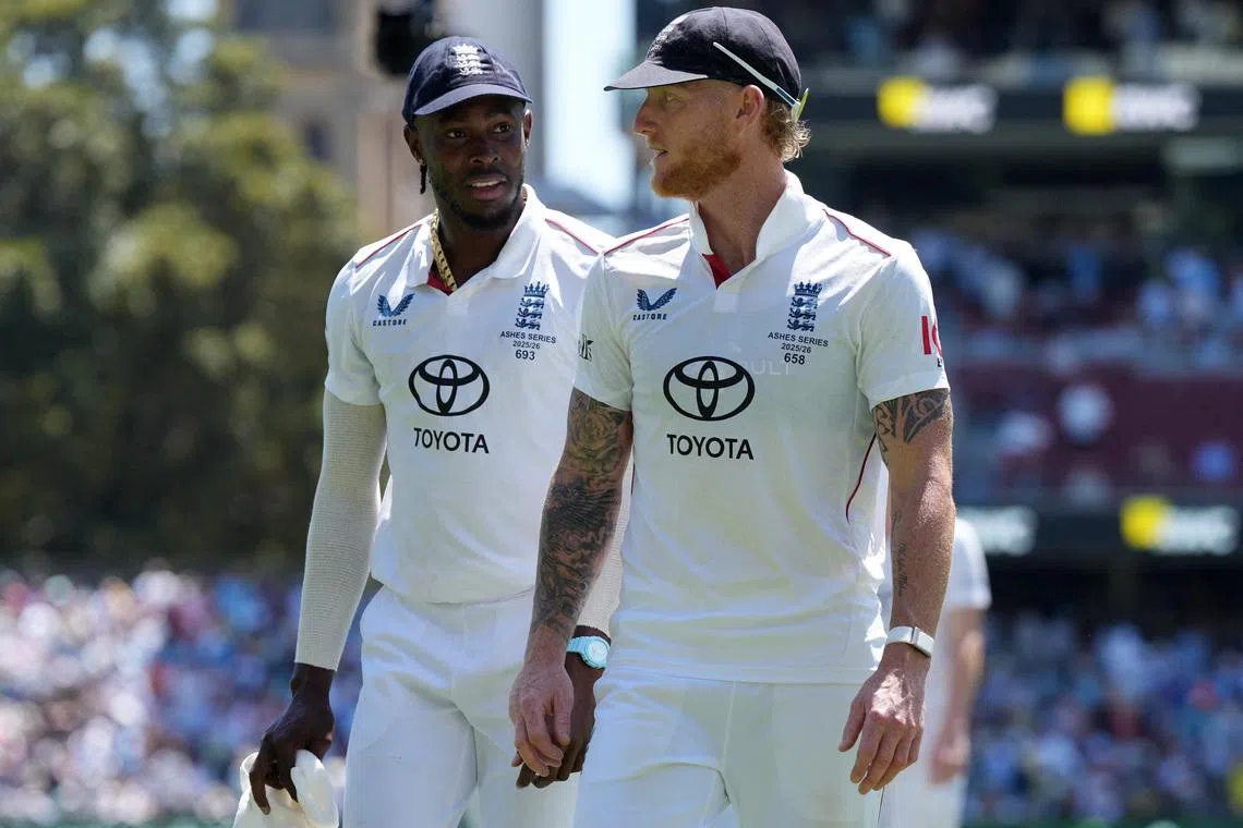 Cricket - The Ashes - Australia v England - Third Test - Adelaide Oval, Adelaide, Australia - December 20, 2025 England's Jofra Archer and Ben Stokes walk off after the end of Australia innings REUTERS/Asanka Brendon Ratnayake