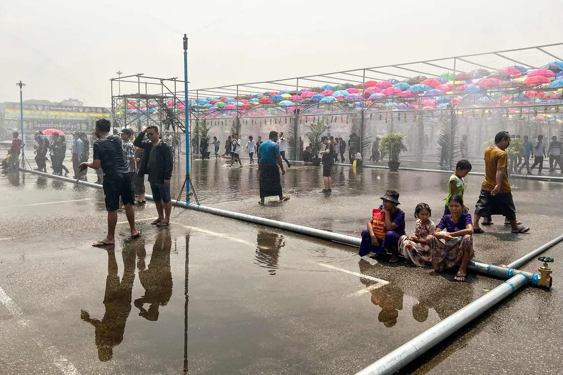 People celebrate with water during the Myanmar's New Year water festival, locally known as Thingyan, in Yangon on April 13.