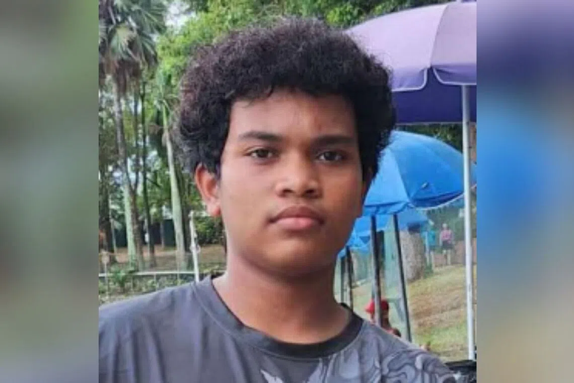 Rayyan Muhammad Faizal was seen wearing a blue shirt and shorts, riding a green bicycle.