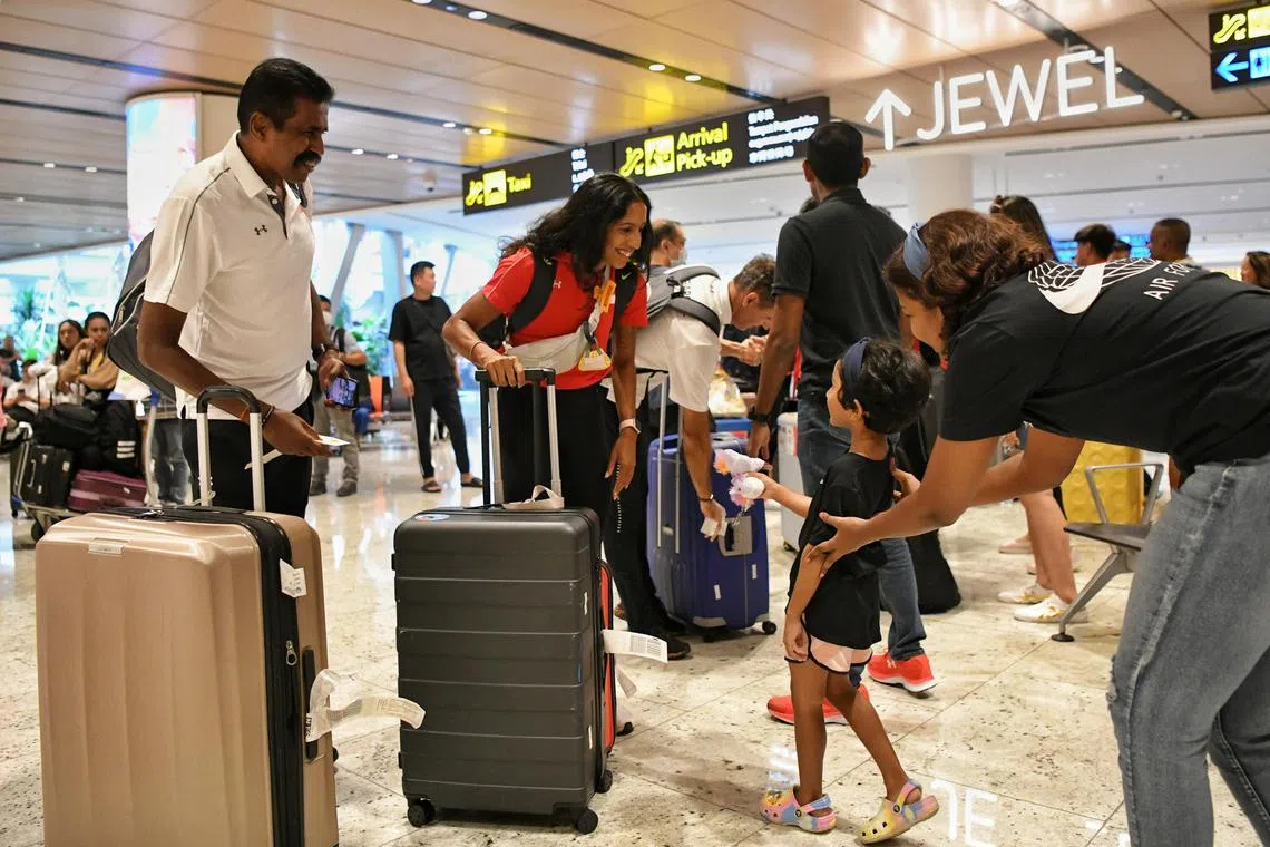 ST20230717_202377067490/kktrack17/Shintaro Tay/
Shanti Pereira arrived at Changi Airport's Terminal 1 on July 17, 2023,  after her double gold salvo at the Asian Athletics Championships in Bangkok.
Neha Mohanaganesh, 5, gave a unicorn plush toy to Shanti Pereira when she arrived at the airport as she felt that "Shanti was so fast, she ran like a unicorn".