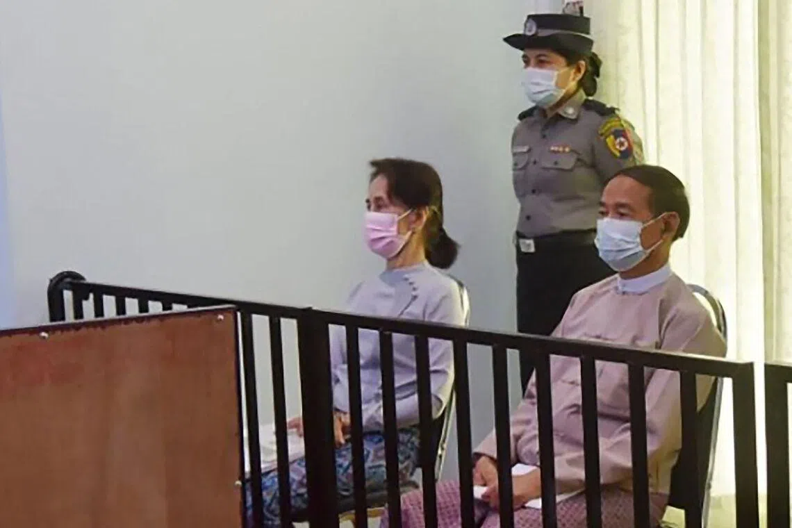 Myanmar's former Myanmar leader Aung San Suu Kyi and president Win Myint in court in May 2021.