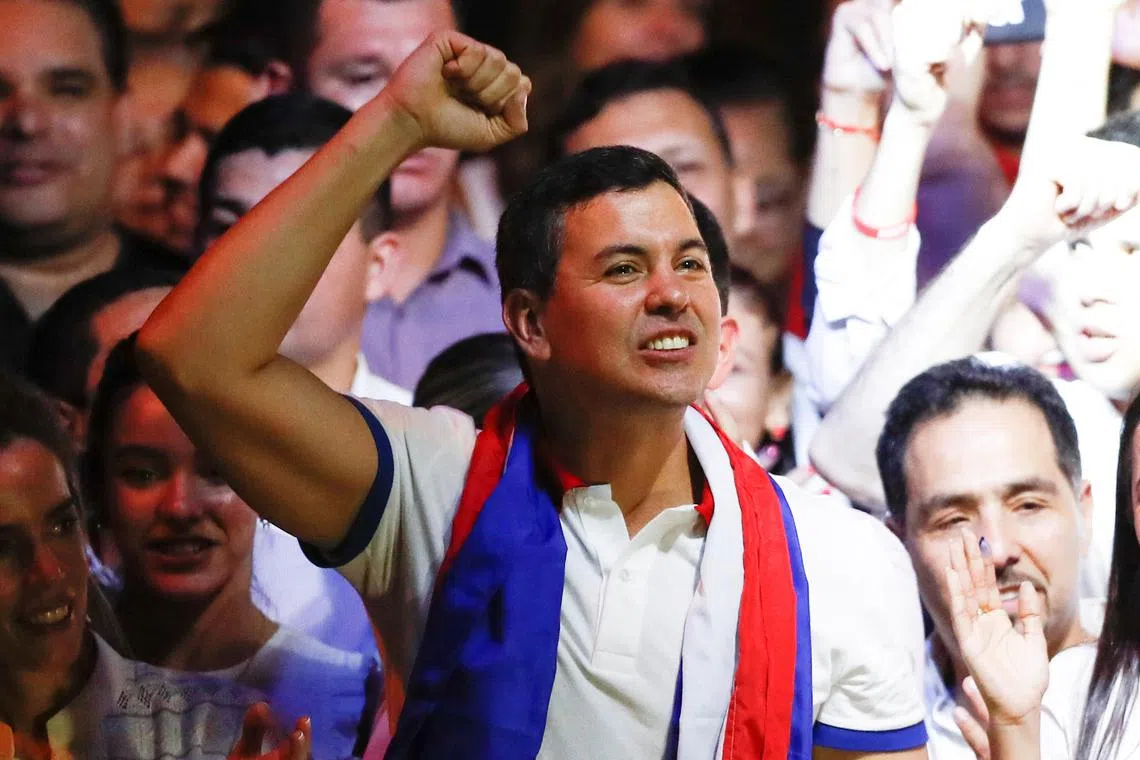 Paraguayan presidential candidate Santiago Pena from the ruling Colorado Party celebrates at the party headquarters as he and his running mate Pedro Alliana won Paraguay's presidential race, according to the preliminary official count, in Asuncion, Paraguay April 30, 2023. REUTERS/Agustin Marcarian
