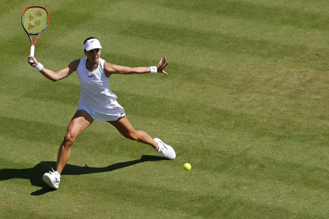 Jun 30, 2025; Wimbledon, United Kingdom; Viktoriya Tomova (BUL) hits a forehand against Ons Jabeur (TUN)(not pictured) on day one of The Championships, Wimbledon 2025 at All England Lawn Tennis and Croquet Club. Mandatory Credit: Geoff Burke-Imagn Images