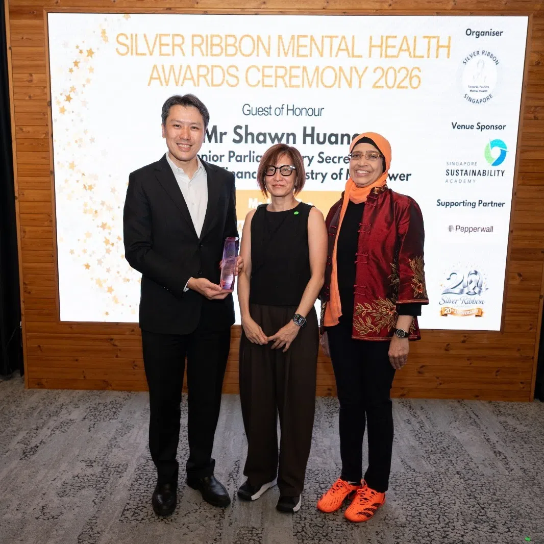 The Straits Times’ senior health correspondent Joyce Teo (centre) received the Media Excellence in Mental Health Awareness Award from Senior Parliamentary Secretary for Finance and Manpower Shawn Huang (left) and Fatimah Lateef (right), President of Silver Ribbon (Singapore).