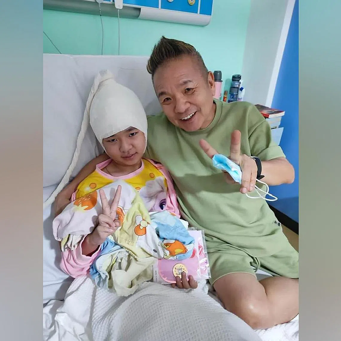 Local artiste Marcus Chin and his daughter Elise.