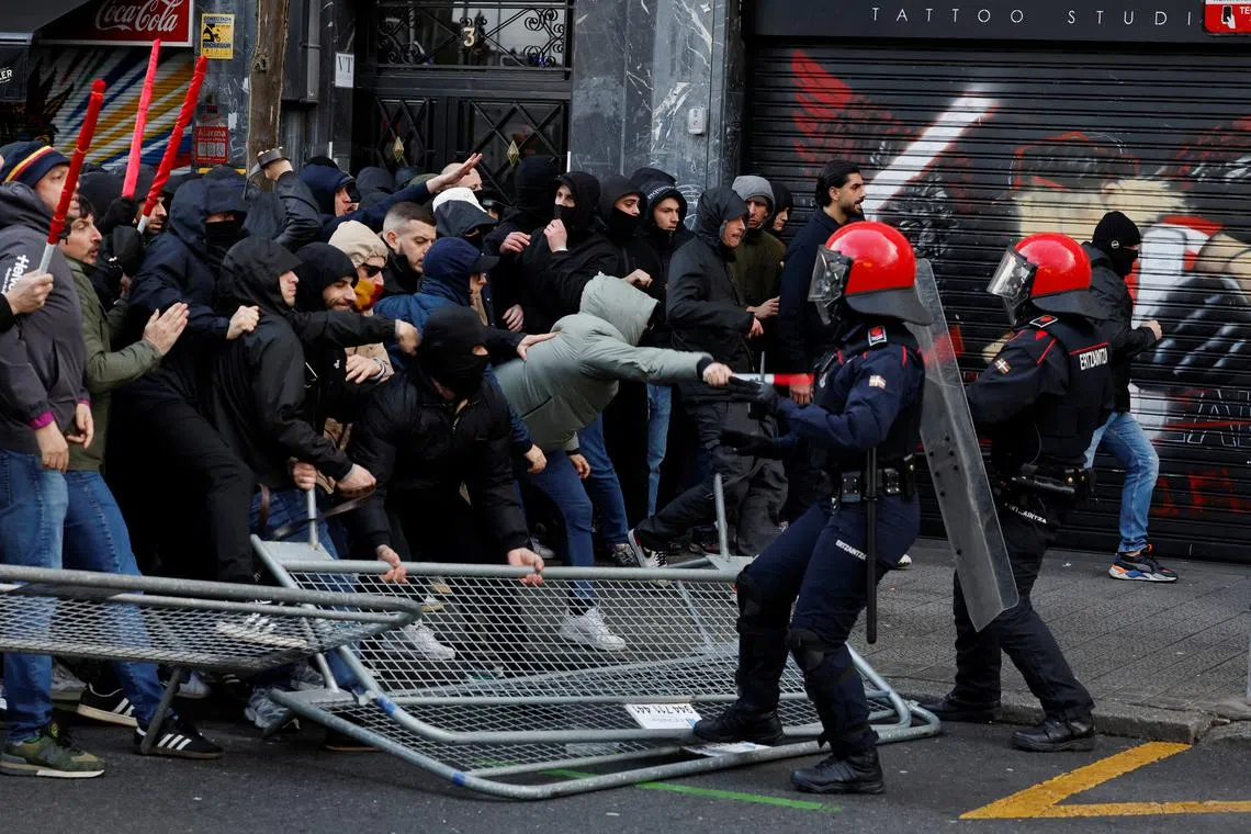 AS Roma fans clashing with police officers outside the stadium before the match between Athletic Bilbao and AS Roma at the San Mames, in Bilbao, Spain, on Mar 13, 2025 