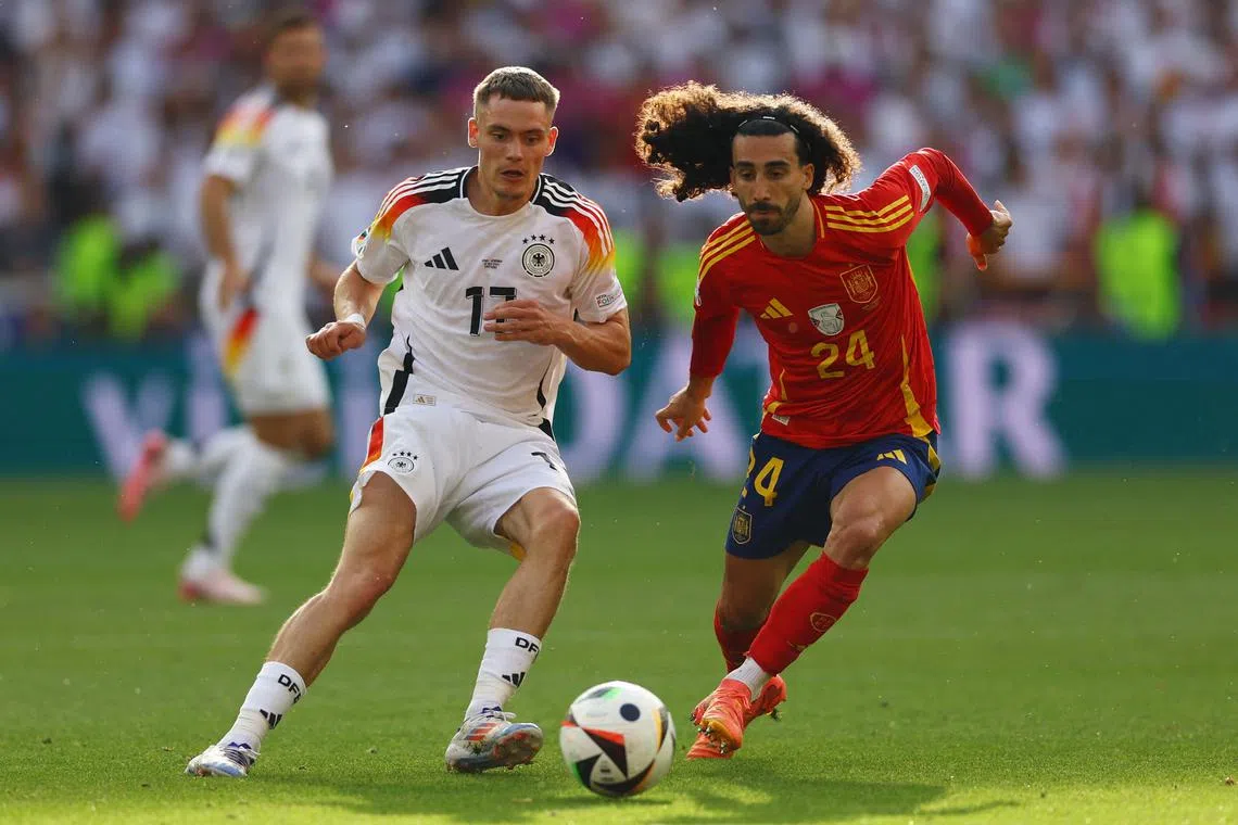FILE PHOTO: Soccer Football - Euro 2024 - Quarter Final - Spain v Germany - Stuttgart Arena, Stuttgart, Germany - July 5, 2024 Germany's Florian Wirtz in action with Spain's Marc Cucurella REUTERS/Lee Smith/File Photo