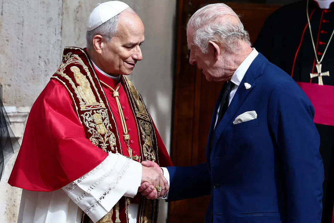 Britain's King Charles shakes hands with Pope Leo XIV in the courtyard of San Damaso, following an ecumenical prayer in the Sistine Chapelle led by the Pope and Archbishop of York Stephen Cottrell, at the Vatican, October 23, 2025. REUTERS/Yara Nardi