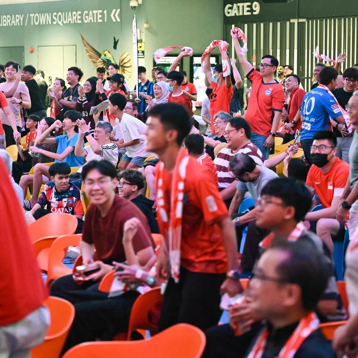 Fans react as Singapore score a goal during the watch party organised by the Football Association of Singapore for the winners-take-all Asian Cup qualifier between Hong Kong and Singapore at Our Tampines Hub on Nov 18, 2025. Singapore won 2-1 against Hong Kong.