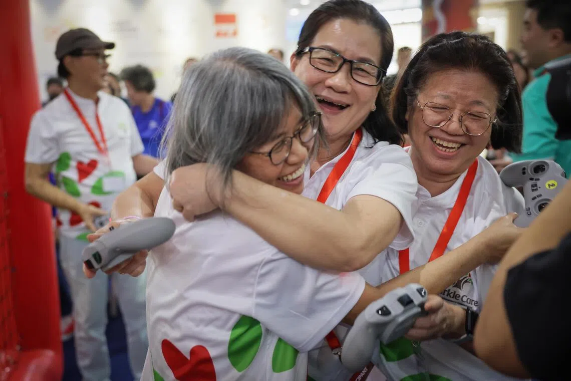 Seniors from PCF Sparkle Care Active Ageing Centre (Care) @ Eunos cheering after winning against THK Active Ageing Centres@Toa Payoh 
 in drone soccer tournament final at Compass One on Aug 1.