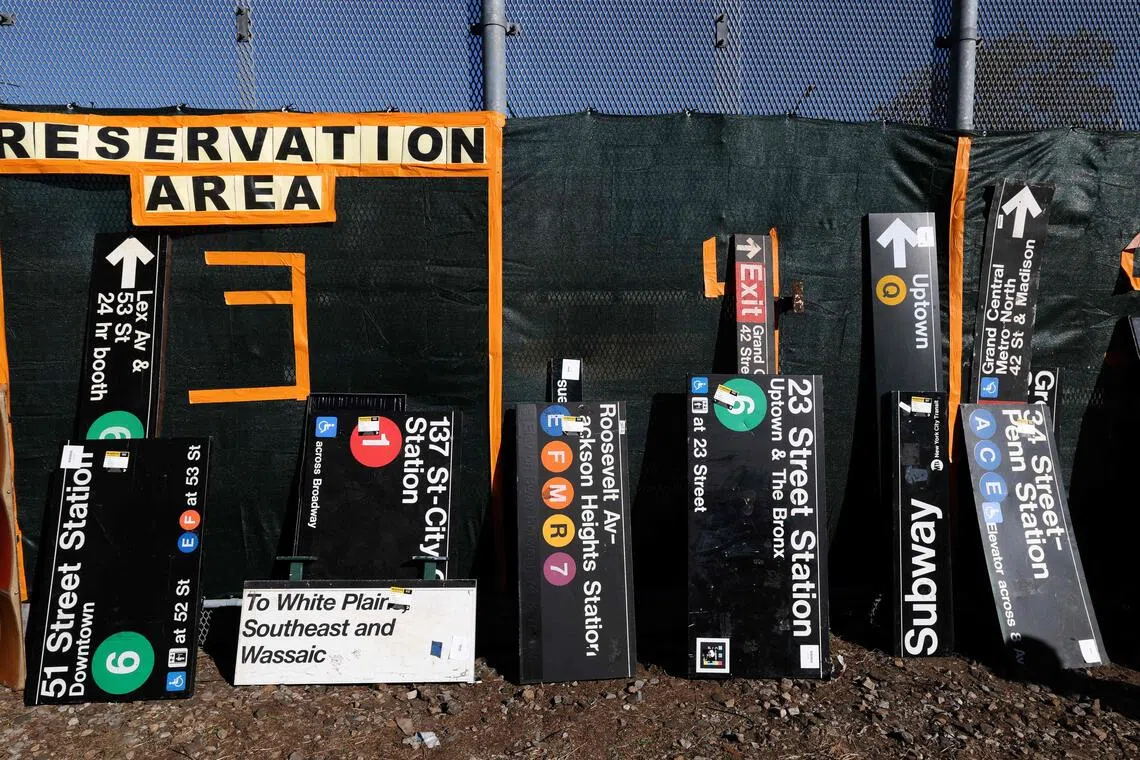 Signs from New York City’s transportation system are seen during NYC Transit’s annual pop-up sale in New York on Oct 9.