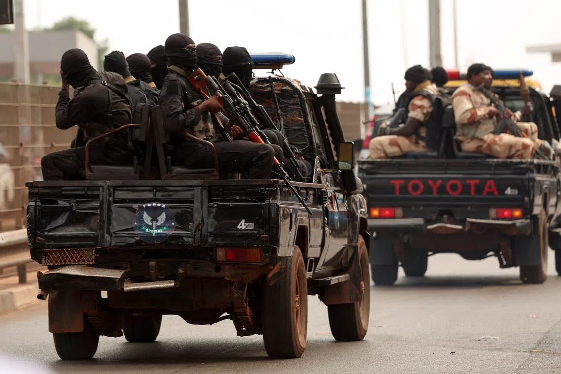 Soldiers patrol on the main road in Bissau, Guinea-Bissau, November 21, 2025. REUTERS/Luc Gnago
