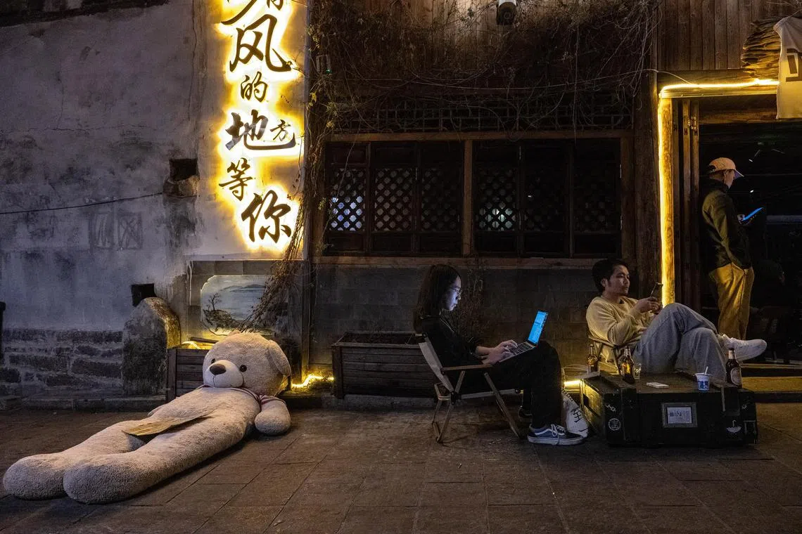Digital nomads work remotely in Dali, China, on Dec 5, 2023. 
