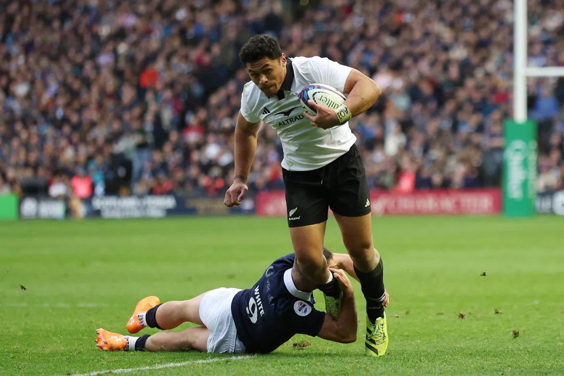 Rugby Union - Autumn Internationals - Scotland v New Zealand - Murrayfield Stadium, Edinburgh, Scotland, Britain - November 8, 2025 New Zealand's Caleb Clarke in action with Scotland's Ben White REUTERS/Russell Cheyne