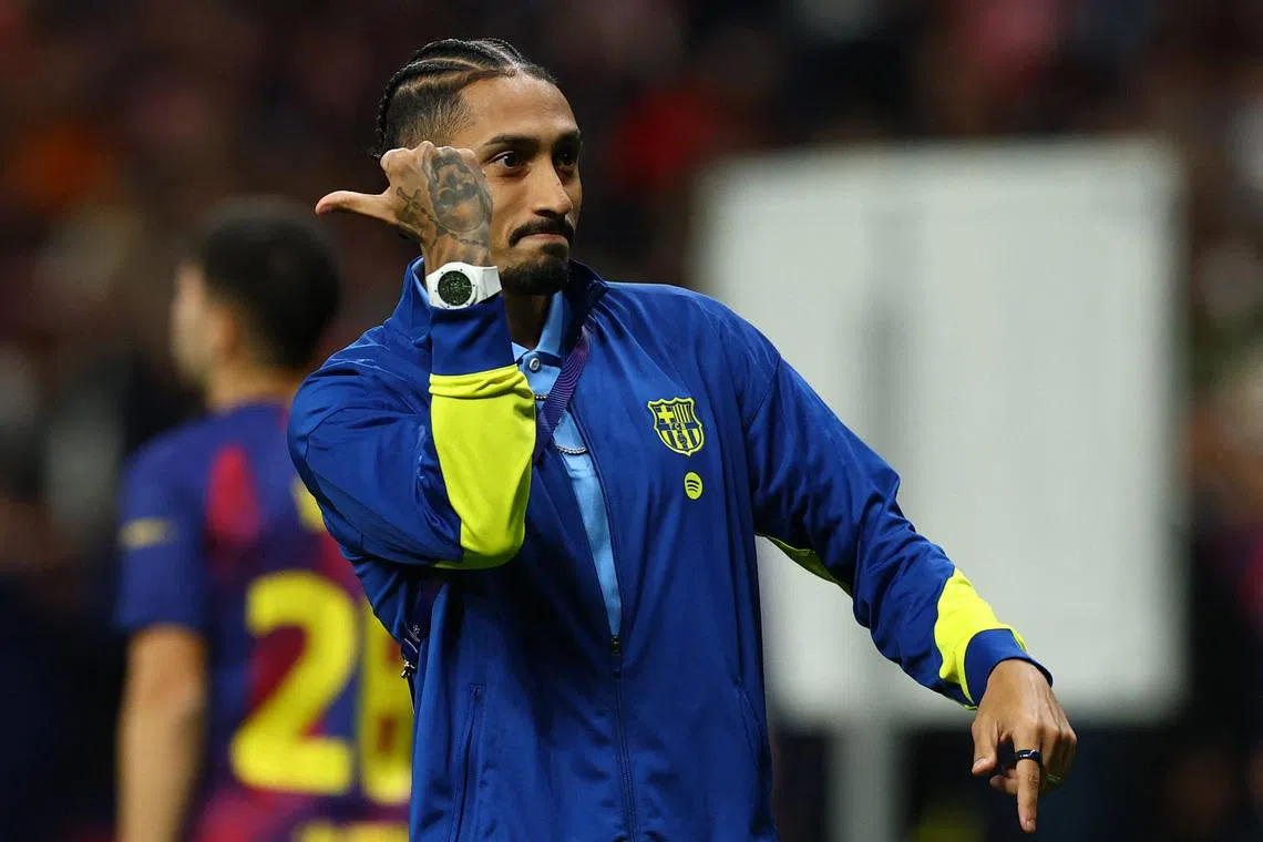 Soccer Football - UEFA Champions League - Quarter Final - Second Leg - Atletico Madrid v FC Barcelona - Riyadh Air Metropolitano, Madrid, Spain - April 14, 2026 FC Barcelona's Raphinha looks dejected after the match REUTERS/Albert Gea