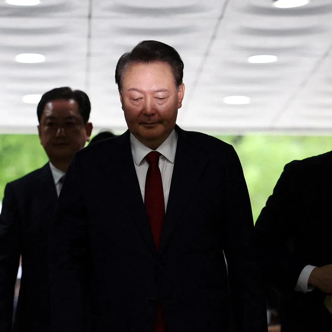 FILE PHOTO: Former South Korean President Yoon Suk Yeol arrives at a court to attend a hearing to review his arrest warrant requested by special prosecutors in Seoul, South Korea, July 9, 2025. REUTERS/Kim Hong-Ji/Pool/File Photo