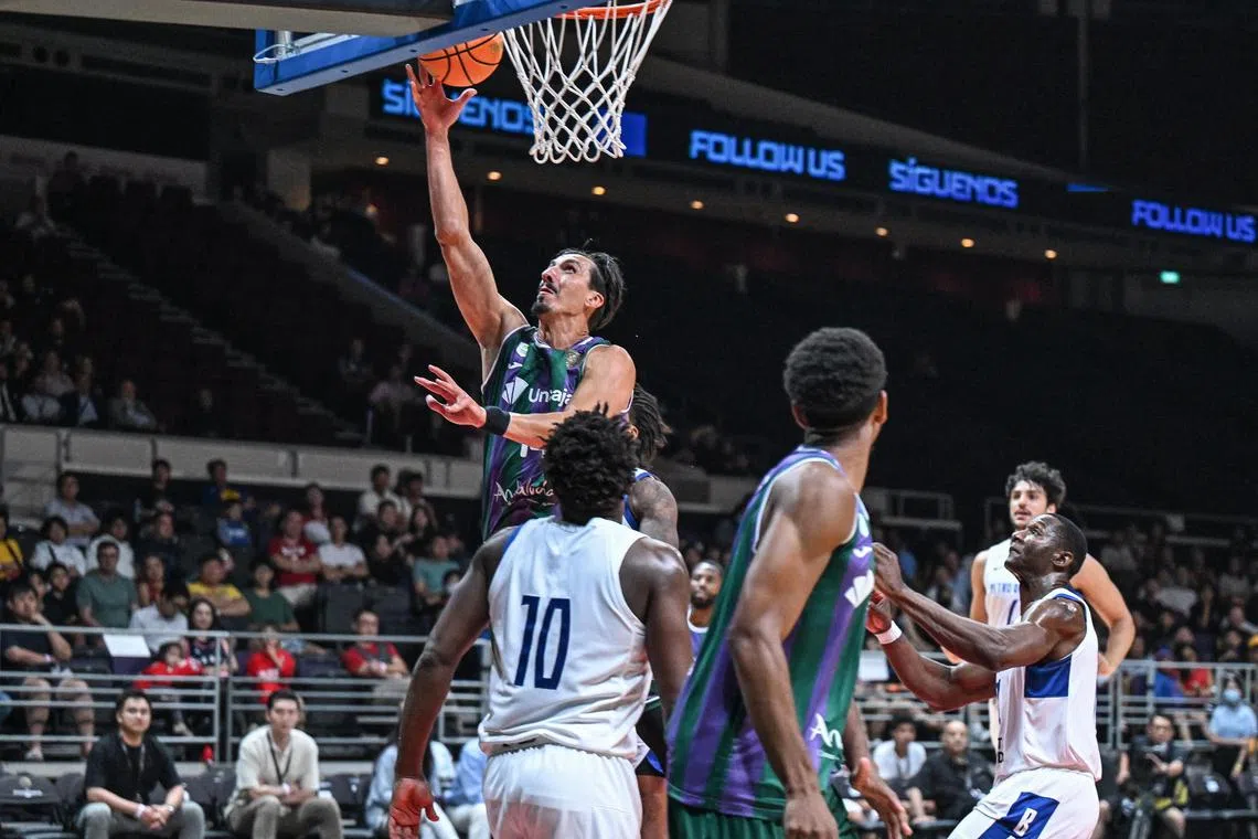Unicaja's Nihad Dedovic scoring a layup in their 94-78 win over Petro de Luanda. He was one of five players who scored double figures.