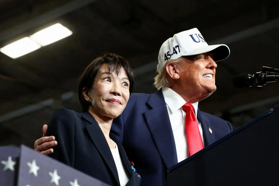 Japanese Prime Minister Sanae Takaichi and US President Donald Trump aboard the aircraft carrier USS George Washington on Oct 28, 2025. 