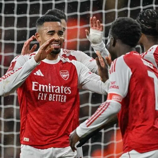 Arsenal's Brazilian striker Gabriel Jesus (left) celebrates with teammates after scoring the team's fourth goal against Wigan Athletic at the Emirates Stadium in London on Feb 15.