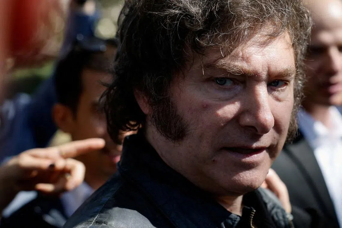 FILE PHOTO: Argentina's President Javier Milei looks on as he visits the debris of a house burnt during the deadly October 7 attack by gunmen from Palestinian militant group Hamas from the Gaza Strip, in Kibbutz Nir Oz in southern Israel, February 8, 2024. REUTERS/Amir Cohen/File Photo