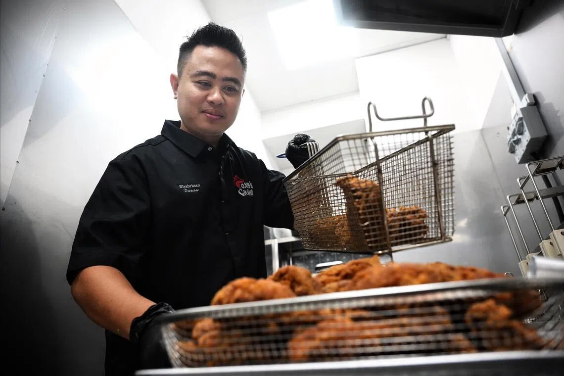 Shahrizan frying chicken at Foxy’s Chikn.