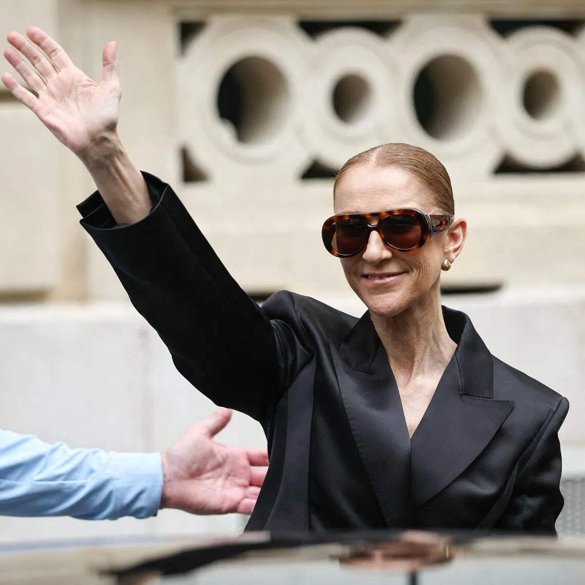 Canadian singer Celine Dion waving to fans in Paris on Sept 3, ahead of a series of concerts in the French capital.