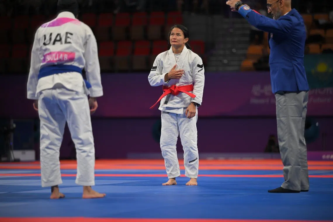 Meggie Ochoa crying after winning the women's Under-48kg ju-jitsu gold medal match at the Hangzhou Asian Games.
