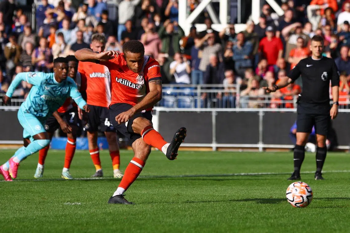 Carlton Morris scores for Luton Town from the penalty spot.