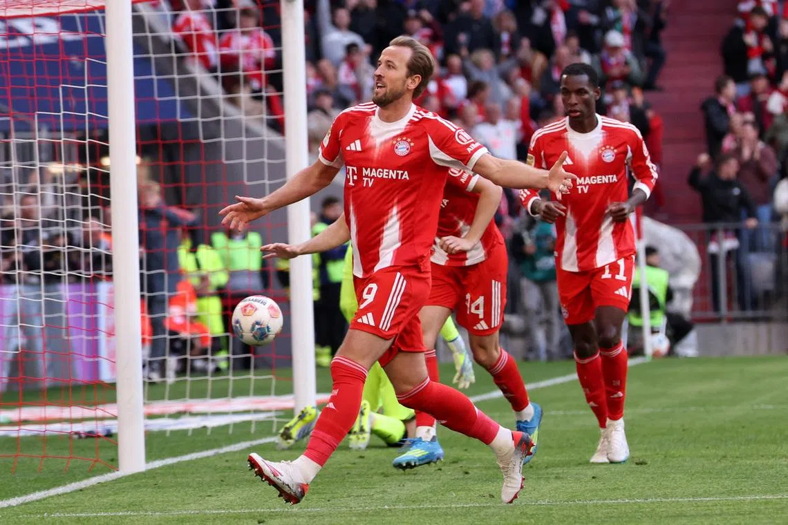 Bayern Munich's Harry Kane celebrates scoring their fourth goal. The Bavarians were a goal down before scoring four times to quickly turn the game around.