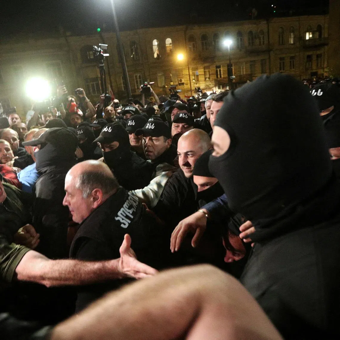 FILE PHOTO: Member of the Georgian Parliament Aleko Elisashvili shouts in front of law enforcement officers during a protest against a draft bill on \"foreign agents\" in Tbilisi, Georgia April 17, 2024. REUTERS/Irakli Gedenidze/File Photo