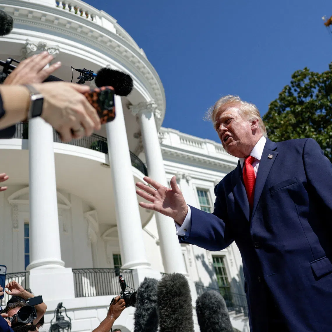 FILE PHOTO: US President Donald Trump speaks to reporters before boarding Marine One as he departs for Denton, Texas, on the South Lawn of the White House in Washington, D.C., US, October 1, 2026. REUTERS/Evan Vucci/File Photo
