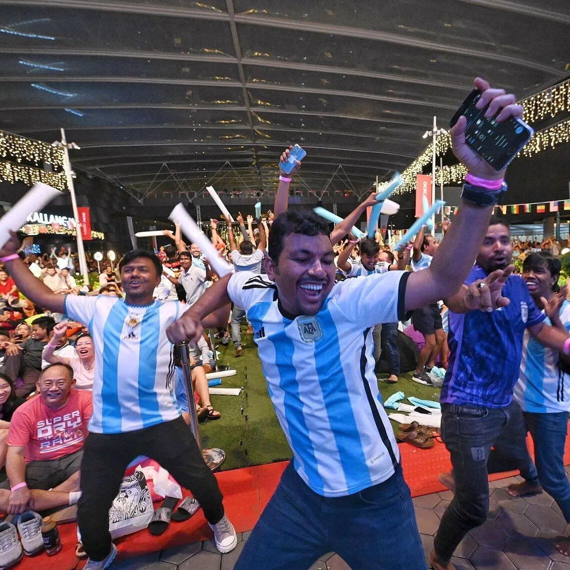 Argentina supporters at the OCBC Square celebrating during the public screening of the 2022 World Cup final between Argentina and France.