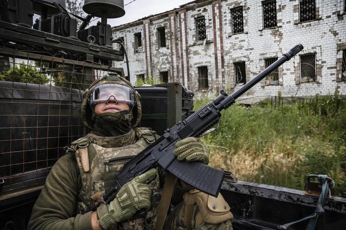 A Ukrainian soldier keeps a lookout for Russian drones in the city of Kostyantynivka, Ukraine.