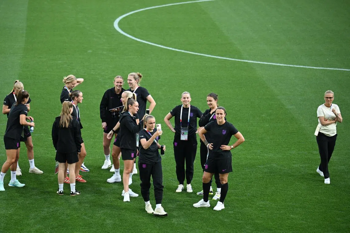 Soccer Football - UEFA Women's Euro 2025 - Group D - England v Wales - Arena St. Gallen, St. Gallen, Switzerland - July 13, 2025 England manager Sarina Wiegman and players on the pitch before the match REUTERS/Annegret Hilse/File Photo