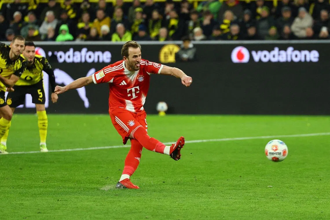 Soccer Football - Bundesliga - Borussia Dortmund v Bayern Munich - Signal Iduna Park, Dortmund, Germany - February 28, 2026 Bayern Munich's Harry Kane scores their second goal from the penalty spot REUTERS/Wolfgang Rattay