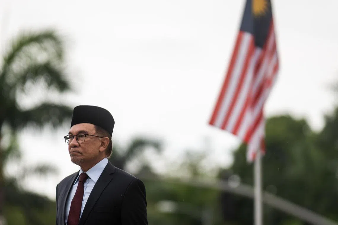 Malaysia's Prime Minister Anwar Ibrahim attends a wreath-laying ceremony at Rizal Park in Manila on March 2, 2023.