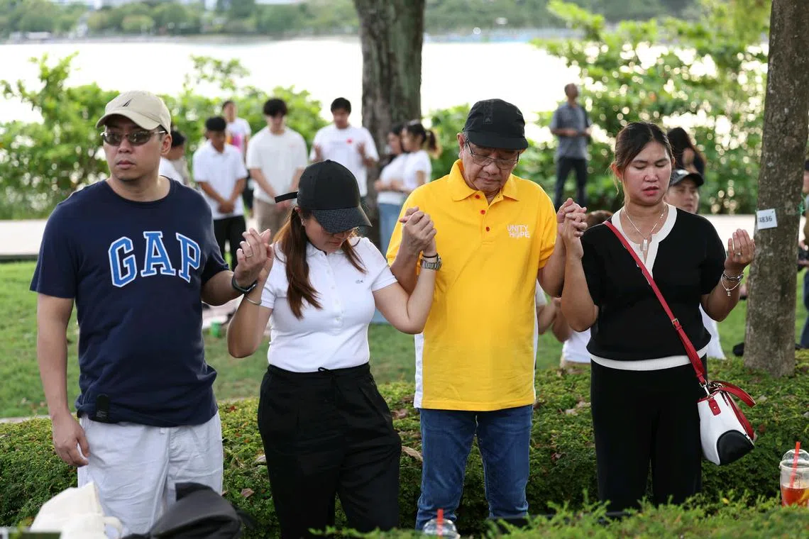 Members of the Catholic community, who were unable to get tickets to the Papal Mass, praying outside the National Stadium on September 12, 2024.