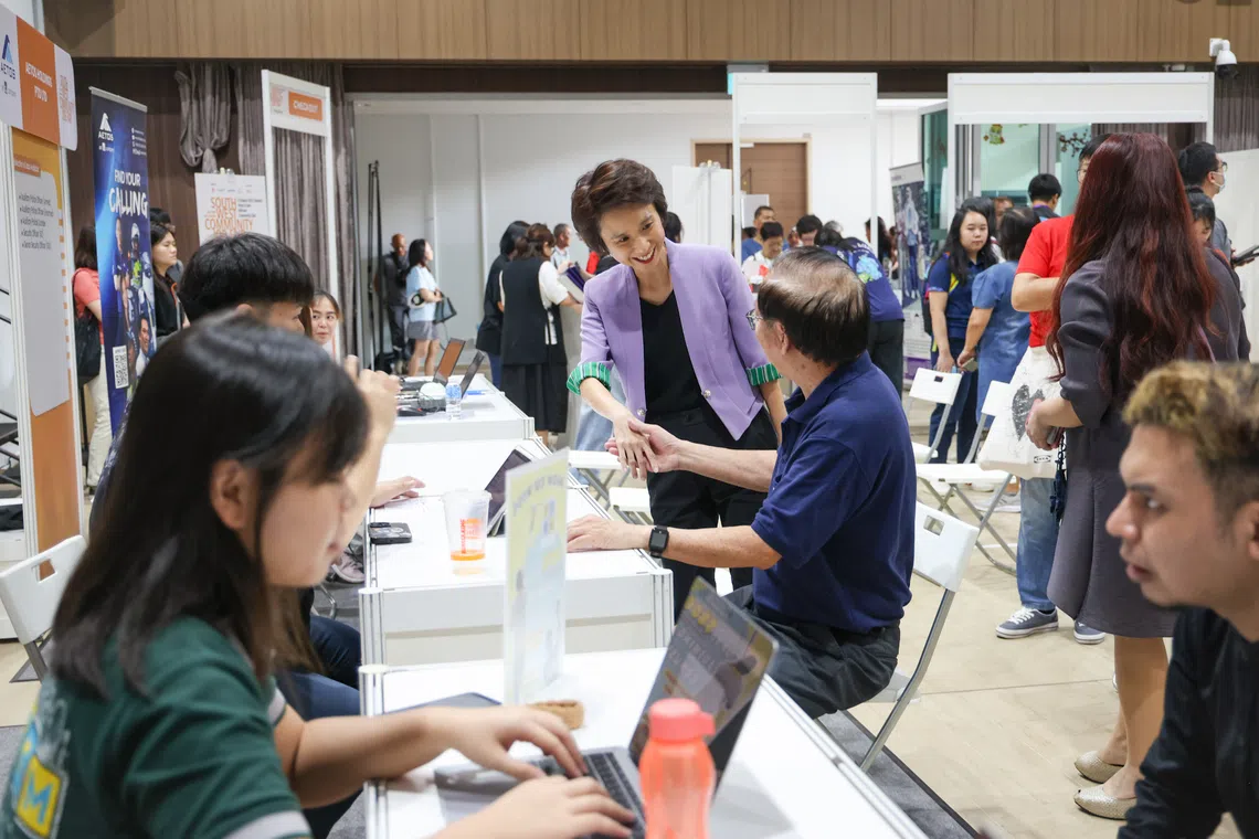 South West District Mayor Low Yen Ling (in purple jacket) meeting jobseekers at the job fair held at Hillview Community Club on Aug 31.