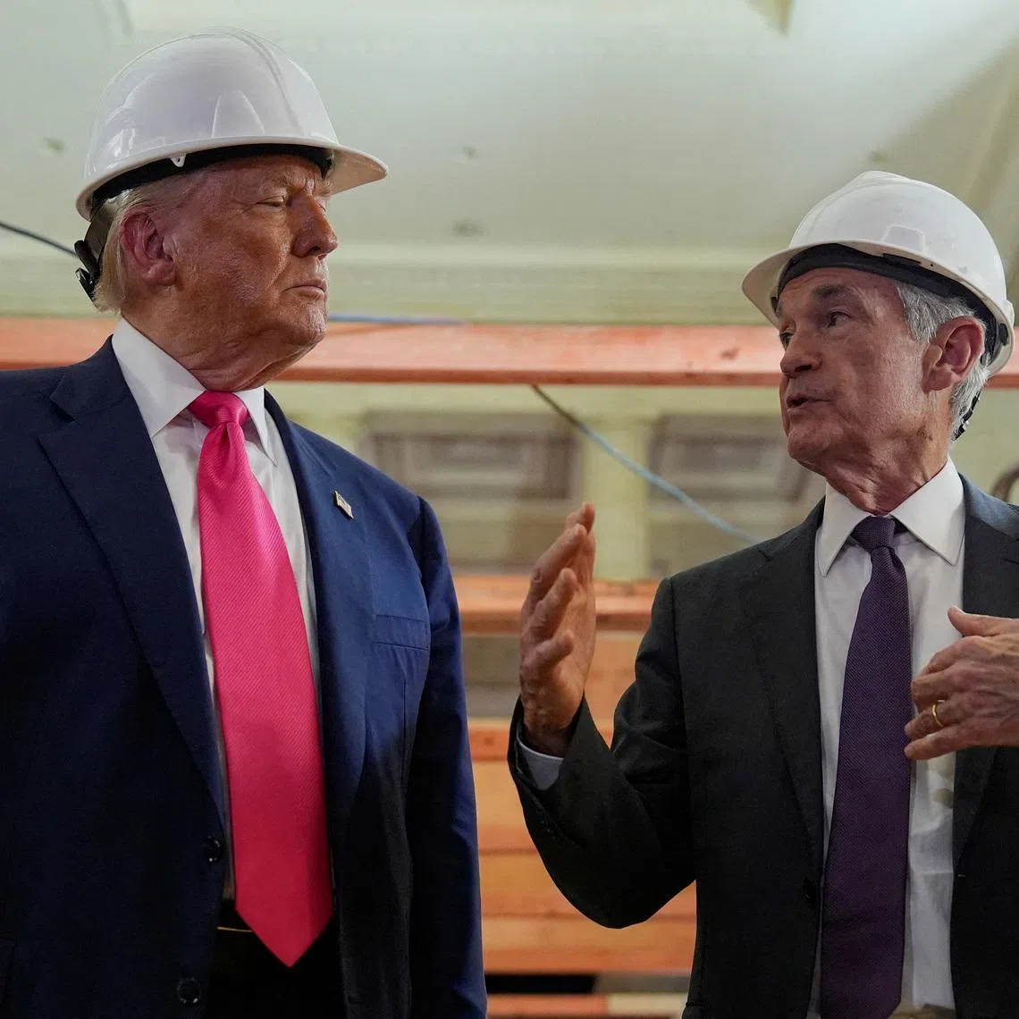 FILE PHOTO: U.S. President Donald Trump and Federal Reserve Chair Jerome Powell speak during a tour of the Federal Reserve Board building, which is currently undergoing renovations, in Washington, D.C., U.S., July 24, 2025. REUTERS/Kent Nishimura/File Photo