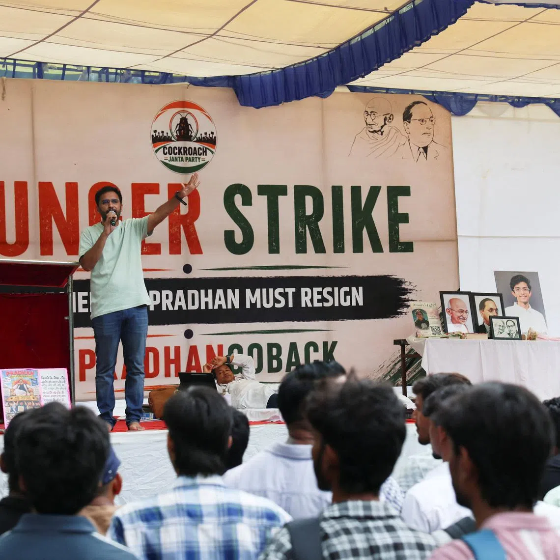 Supporters of the Cockroach Janta Party at a sit-in protest in New Delhi on June 30, demanding the resignation of Indian Education Minister Dharmendra Pradhan.