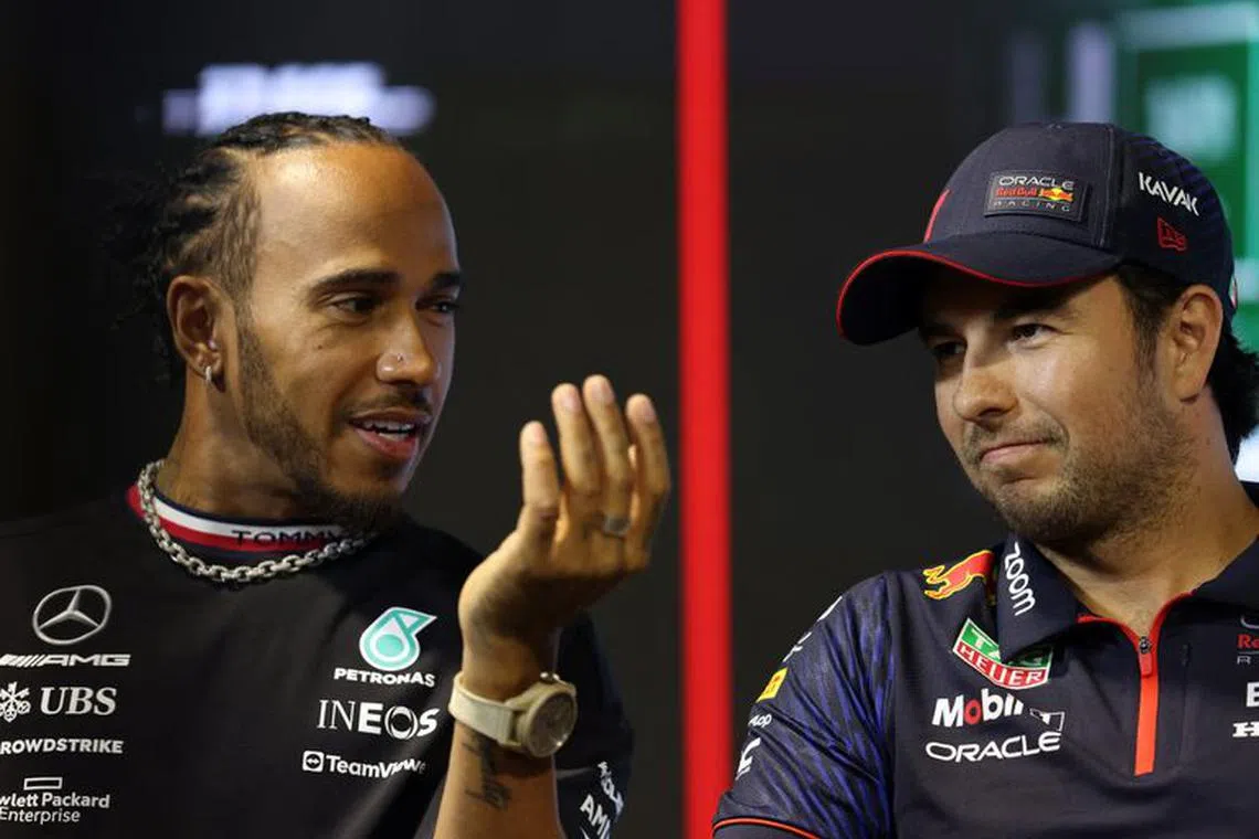 FILE PHOTO:Formula One F1 - Saudi Arabian Grand Prix - Jeddah Corniche Circuit, Jeddah, Saudi Arabia - March 16, 2023 Mercedes' Lewis Hamilton and Red Bull's Sergio Perez during the press conference ahead of the Grand Prix REUTERS/Ahmed Yosri/File Photo